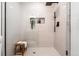 Modern bathroom with white tile shower, black hardware and decorative inset shelf for a spa-like feel at 3061 S Glencoe St, Denver, CO 80222