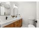Elegant bathroom featuring dual sinks, modern fixtures, and a clean, bright design at 3061 S Glencoe St, Denver, CO 80222