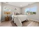 Bright bedroom with natural light and a comfortable bed with stylish accents at 3061 S Glencoe St, Denver, CO 80222