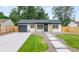 Charming single story home with well-manicured lawn, walkway, garage and neutral exterior at 3061 S Glencoe St, Denver, CO 80222