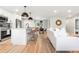 Stylish kitchen with seating island, stainless steel appliances, and an open layout at 3061 S Glencoe St, Denver, CO 80222