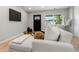 Comfortable living room with a plush white sofa and modern decor at 3061 S Glencoe St, Denver, CO 80222