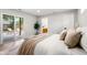 Serene main bedroom with sliding glass doors, neutral tones, and a cozy atmosphere at 3061 S Glencoe St, Denver, CO 80222