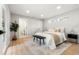 Spacious main bedroom with a comfortable bed, stylish rug, and ample natural light at 3061 S Glencoe St, Denver, CO 80222
