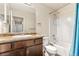 Clean bathroom with white fixtures, a granite countertop vanity, and shower at 47385 Lily Ave, Bennett, CO 80102