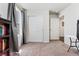 Carpeted bedroom featuring closet, large window, and neutral paint at 47385 Lily Ave, Bennett, CO 80102