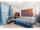 Cozy bedroom with a comfortable bed, large window, and stylish decorations at 47385 Lily Ave, Bennett, CO 80102