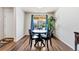 Cozy dining area with hardwood floors, a round table, and plenty of natural light at 47385 Lily Ave, Bennett, CO 80102