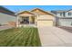 Charming single-Gathering home featuring a well-manicured lawn and inviting front porch at 47385 Lily Ave, Bennett, CO 80102
