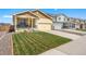 Beautiful single-Gathering home with a well-maintained lawn and a cozy front porch at 47385 Lily Ave, Bennett, CO 80102