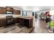 Modern kitchen equipped with stainless steel appliances and dark cabinets at 47385 Lily Ave, Bennett, CO 80102