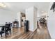 Spacious living area featuring hardwood floors and seamless access to the kitchen area at 47385 Lily Ave, Bennett, CO 80102