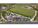 Overhead view of a green community park with a playground, playing field, and parking at 6751 Arbor E Blvd, Thornton, CO 80602