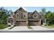Charming two-story home with a two car garage and a well-manicured lawn at 6751 Arbor E Blvd, Thornton, CO 80602
