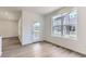 Living Room area with a large window that brings in lots of natural light and a glass door to a small deck at 6751 Arbor E Blvd, Thornton, CO 80602