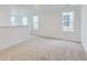Bright loft area with neutral carpet and multiple windows for lots of natural light at 6751 Arbor E Blvd, Thornton, CO 80602