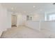 Bright and open loft with plush carpet and crisp white walls at 6751 Arbor E Blvd, Thornton, CO 80602
