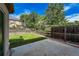 Fenced backyard with patio and grassy area at 12783 Ivy St, Thornton, CO 80602