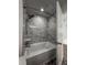 Bathroom featuring a tiled shower and tub with rainfall shower head at 12783 Ivy St, Thornton, CO 80602