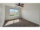 Bedroom featuring natural light from a window overlooking the backyard at 12783 Ivy St, Thornton, CO 80602