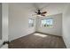 Cozy bedroom with a ceiling fan, carpet, and natural light at 12783 Ivy St, Thornton, CO 80602