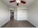 Neutral bedroom featuring a ceiling fan, closet with bi-fold doors, and easy access to other rooms at 12783 Ivy St, Thornton, CO 80602