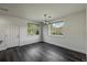 Bright dining room featuring new floors, large window and view of the front yard at 12783 Ivy St, Thornton, CO 80602