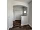 Bright entryway with white trim, wood flooring, and a large coat closet at 12783 Ivy St, Thornton, CO 80602