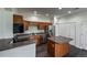 Modern kitchen with stainless steel appliances, island and white cabinets at 12783 Ivy St, Thornton, CO 80602