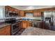 Well-equipped kitchen featuring stainless steel appliances and ample cabinet space at 12783 Ivy St, Thornton, CO 80602