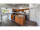 Modern kitchen with stainless steel appliances and an island at 12783 Ivy St, Thornton, CO 80602