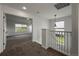 Second floor landing featuring neutral carpet and window allowing natural light at 12783 Ivy St, Thornton, CO 80602