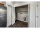 Laundry room with shelving, washer and dryer hookups and closet space at 12783 Ivy St, Thornton, CO 80602