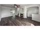 Bright living space with hardwood floors, gas fireplace, and open floor plan at 12783 Ivy St, Thornton, CO 80602