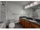 Main bathroom with dual vanity, tile flooring and natural light at 12783 Ivy St, Thornton, CO 80602