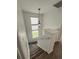 Stairway to second floor with neutral carpet and a window allowing natural light at 12783 Ivy St, Thornton, CO 80602