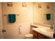 Half bathroom with wainscoting, updated sink and fixtures at 10534 Ursula St, Commerce City, CO 80022