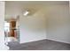 Bright living room with neutral paint, carpet and view into the kitchen at 10534 Ursula St, Commerce City, CO 80022