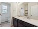 Bathroom featuring double sink vanity, spacious mirror, white countertops and natural light at 1290 Loraine N Cir, Lafayette, CO 80026