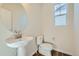 Simple yet elegant powder room with pedestal sink and modern fixtures at 1290 Loraine N Cir, Lafayette, CO 80026