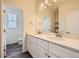 Bathroom boasts double vanity,light cabinets, and a view of the toilet and shower at 1290 Loraine N Cir, Lafayette, CO 80026