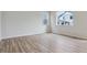 Bright and airy bedroom with wood flooring and natural light streaming through the windows at 1290 Loraine N Cir, Lafayette, CO 80026
