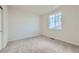 Well-lit bedroom featuring carpet and a window at 1290 Loraine N Cir, Lafayette, CO 80026