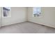 Empty bedroom with plush carpet, neutral walls, and natural light at 1290 Loraine N Cir, Lafayette, CO 80026