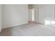 Bedroom with plush carpet, a double door closet, and natural light at 1290 Loraine N Cir, Lafayette, CO 80026