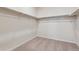 Walk-in closet with carpet and shelving for optimal storage at 1290 Loraine N Cir, Lafayette, CO 80026
