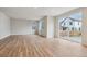 Bright and spacious living room with an open floor plan, wood floors, and a sliding glass door at 1290 Loraine N Cir, Lafayette, CO 80026