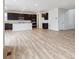 Open-concept living space featuring a modern kitchen, wood flooring, and plenty of natural light at 1290 Loraine N Cir, Lafayette, CO 80026