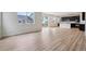 Bright and spacious living room features an open floor plan with wood floors and large windows at 1290 Loraine N Cir, Lafayette, CO 80026