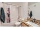 Clean bathroom featuring a tub, shower, and granite countertop at 1747 N Pearl St # 202, Denver, CO 80203